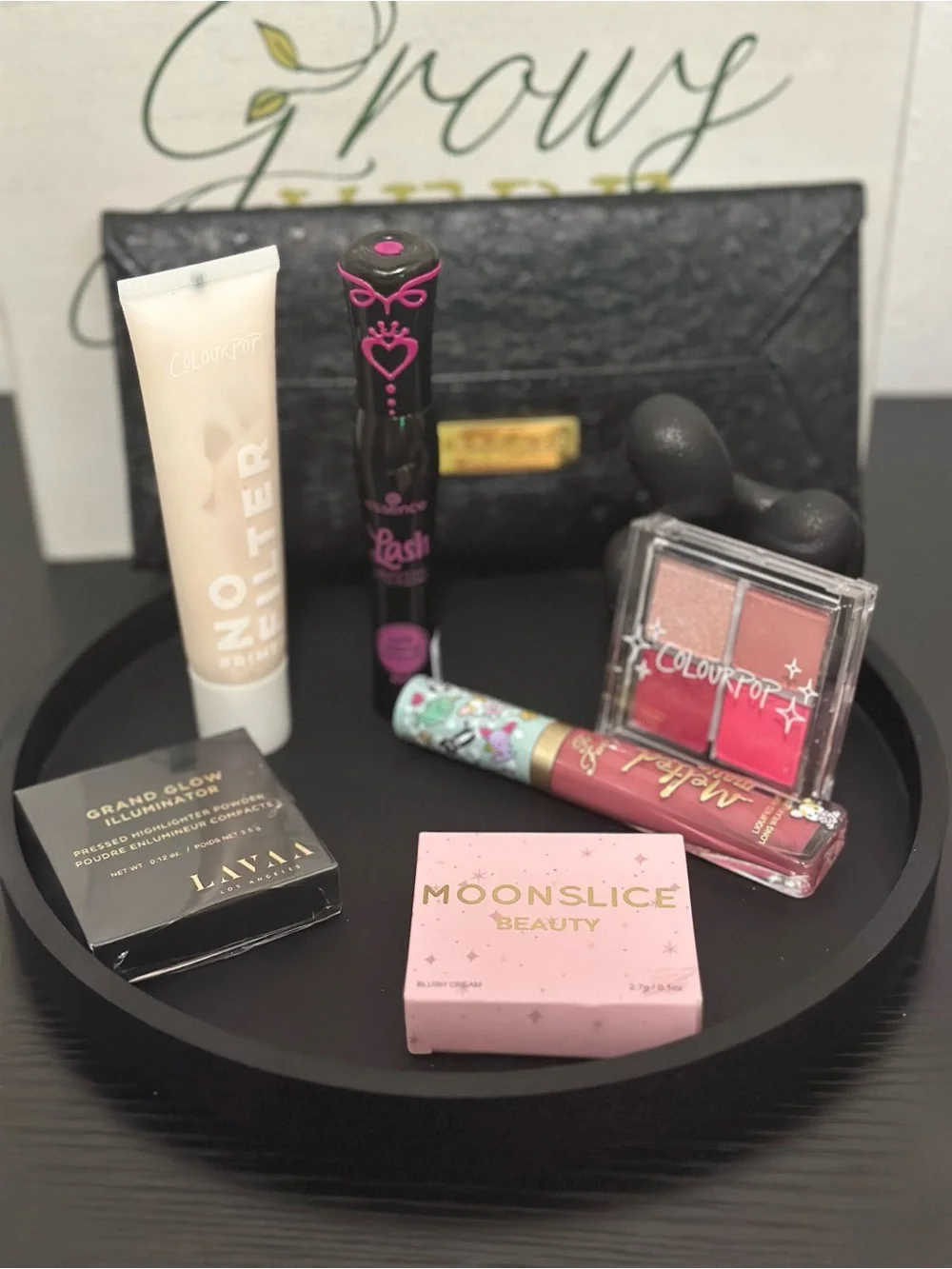 Makeup essentials (7 pieces) with pouch.